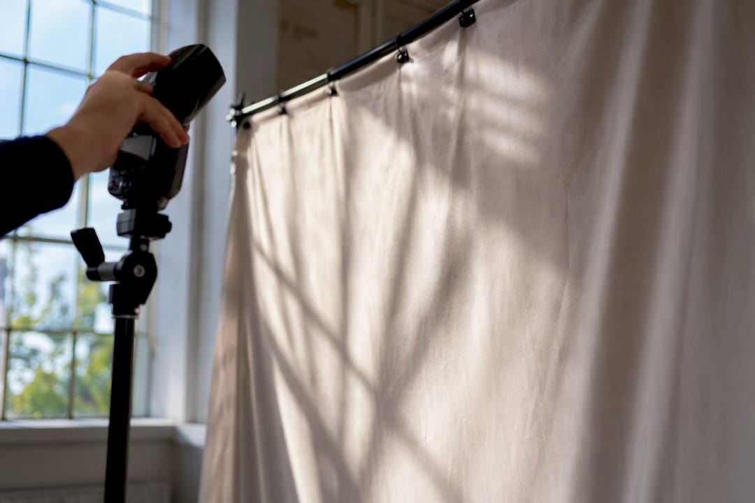 Camera flash illuminating step and repeat backdrop