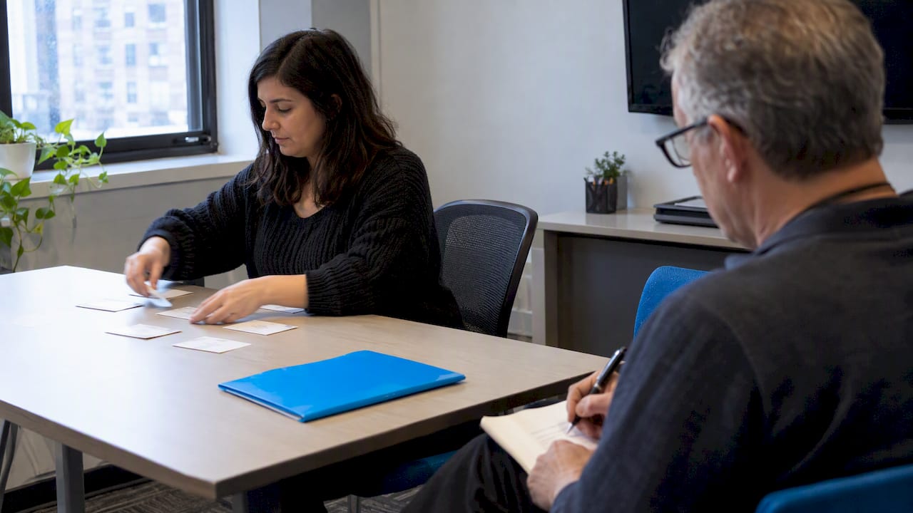 Participant sorting cards during navigation testing