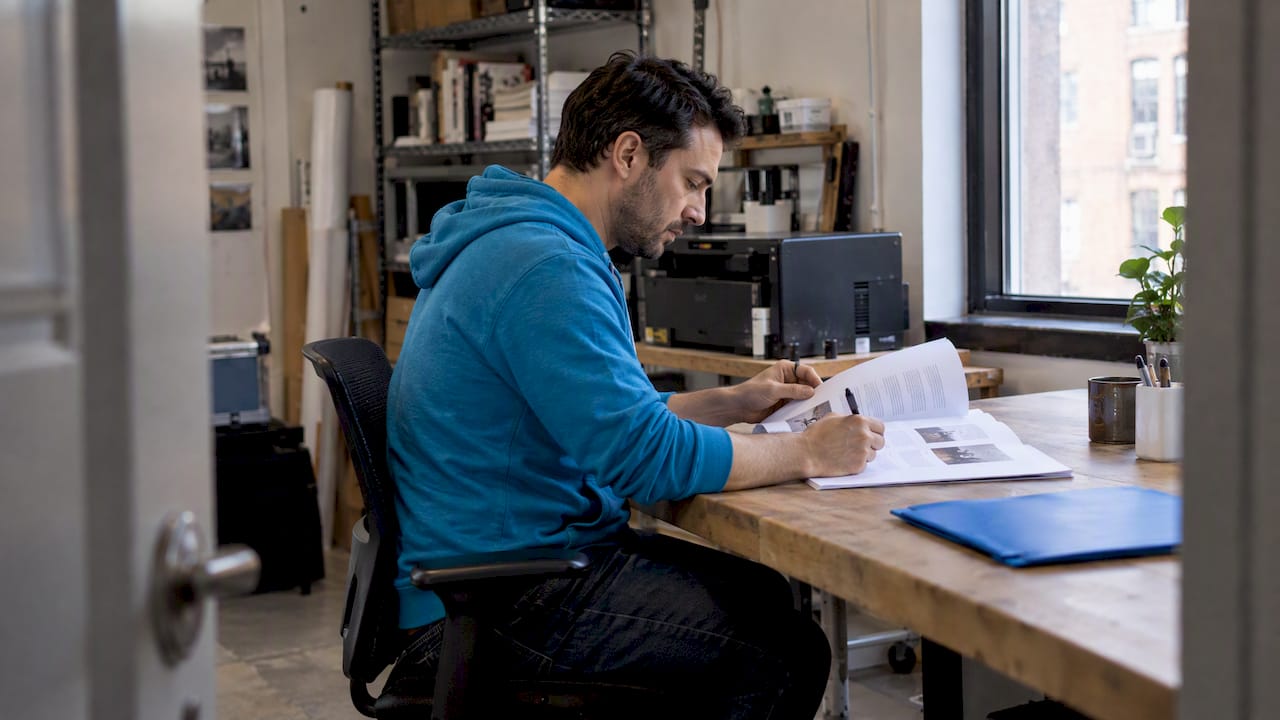 Founder reviewing a printed content guide